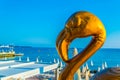 Statue of a flamingo in front of a beach in Cannes, France