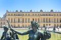 Statue in fountain in front of Palace of Versailles