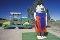 A statue of Fred Flintstone and the Flintstone vehicle at Fred Flintstone Land in Arizona, near the Grand Canyon