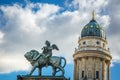 Statue and french dome at Gendarmenmarkt, Berlin at sunset, Germany