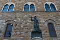 Statue in front of the Facade of Old Palace called Palazzo Vecchio at the Piazza della Signoria in Florence, Tuscany, Italy Royalty Free Stock Photo