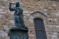 Statue in front of the Facade of Old Palace called Palazzo Vecchio at the Piazza della Signoria in Florence, Tuscany, Italy Royalty Free Stock Photo