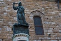 Statue in front of the Facade of Old Palace called Palazzo Vecchio at the Piazza della Signoria in Florence, Tuscany, Italy Royalty Free Stock Photo