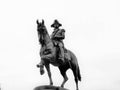 A Statue of George Washington on a black horse