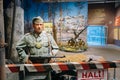 Statue of a German soldier from the gendarmerie Feldgendarmerie stands guard behind a barrier In The Belarusian Museum