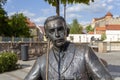 Statue of Geza Gardonyi in Eger, Hungary with the castle of Eger in the background