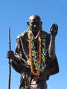Statue of Ghandi wearing real leis Royalty Free Stock Photo