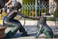 Statue of a girl and her dog at the beautiful Danube Promenade Royalty Free Stock Photo