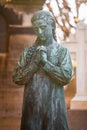 Statue of a girl praying