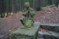 Statue of a girl, stone staircase and trees