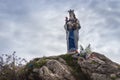 Statue of God Mother with Jesus baby in Pyrenees mountains, France. Sculpture of Our Lady with Jesus Christ on mountain top. Royalty Free Stock Photo