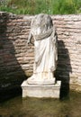 The statue of the goddess Isis Tyche. Archaeological park Dion. Royalty Free Stock Photo