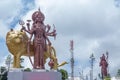 Statue of Goddess Saraswati against cloudy sky. Royalty Free Stock Photo