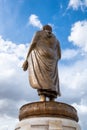 Statue golden buddha standing with blue sky Royalty Free Stock Photo