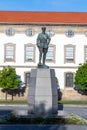 Statue of Gomes da Costa, a former president of Portugal in 1920 with the hall of the people in background