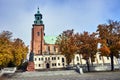 Statue and Gothic cathedral church in autumn