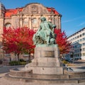 Statue of great scientist Otto von Guericke in red and golden Autumn colors in historical downtown of Magdeburg Germany, at sunny