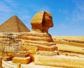 Statue of the Great Sphinx in Giza, Egypt, next to the pyramids of Giza, a human head on the body of a lion Royalty Free Stock Photo