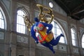 A Statue of a guardian angel with golden wings in Zurich train station