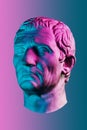 Statue of Guy Julius Caesar Octavian Augustus. Creative concept colorful neon image with ancient roman sculpture Guy