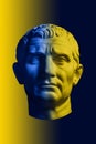 Statue of Guy Julius Caesar Octavian Augustus. Creative concept colorful neon image with ancient roman sculpture Guy