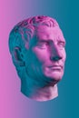 Statue of Guy Julius Caesar Octavian Augustus. Creative concept colorful neon image with ancient roman sculpture Guy