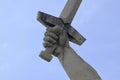 Statue hand holding the sword on the blue sky