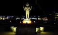 The statue of a Hindu deity with four hands and several faces, night lighting, Asian culture Royalty Free Stock Photo