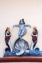 Statue of a Hindu God Krishna killing a Cobra snake on the wal Royalty Free Stock Photo