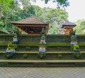 The statue in the Hindu Temple in Ubud Monkey Forest covered by moss, Bali Island, Indonesia Royalty Free Stock Photo