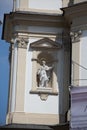 Statue of holy man on wall of old building in city center. Architecture in central square. April, 2013. Vienna, Austria