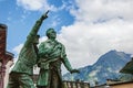 Statue in honor of Balmat and Paccard with alpine landscape in Chamonix Royalty Free Stock Photo