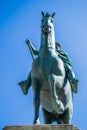 Statue of a horse with a bronze rider. Bottom view, you can only see the horse Royalty Free Stock Photo