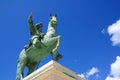 statue of a man riding a horse against blue sky Royalty Free Stock Photo