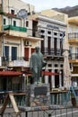 A statue by the houses in city center in Calymnos Island