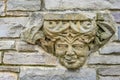 Statue of Human Face in a Rock Wall