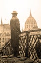 Statue of Imre Nagy looking at the building of Parliament in Budapest