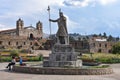 A statue of Inca Pachacutec and Catholic church in the plaza of Vilcashuaman. Ayacucho, Peru