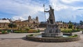 A statue of Inca Pachacutec and Catholic church in the plaza of Vilcashuaman. Ayacucho, Peru