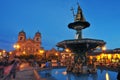 Statue of Inca Pachacutec on fountain and catholic church on Plaza de Armas, evening view, Cusco or Cuzco town, Peru