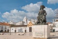 Statue of Infante Dom Henrique Prince Henry in the town square with town buildings to the rear, Lagos, Algarve, Portugal Royalty Free Stock Photo