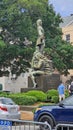 A statue of Jean-Baptiste Le Moyne, Sieur de Bienville, Former Governor of French Louisiana with lush green trees in New Orleans