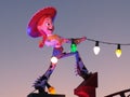 Statue of Jesse from the movie Toy Story holding lights at dusk in Orlando Disney World, Florida Royalty Free Stock Photo