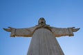 Statue of Jesus Christ, Cristo Rei, standing atop a hill in Lisbon, Portugal