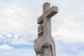 The statue of Jesus Christ with  cross. Cloudy sky on background. concept Christianity Royalty Free Stock Photo