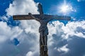 Statue of Jesus Christ on the cross in the Dolomites Royalty Free Stock Photo