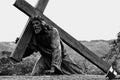 Statue of Jesus christ falling with the cross Royalty Free Stock Photo