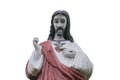 The statue of Jesus Christ. He points a finger at his heart. Primitivism style. White background religion, faith concept Royalty Free Stock Photo