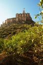 The statue of Jesus Christ on top of a fortress on a mountain in the city of Monteagudo in Spain