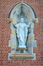 A statue of Jesus Christ in the wall of St Michael and St John Catholic cathedral Royalty Free Stock Photo
